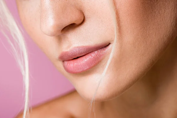 Cropped view of female lips isolated on pink — Stock Photo