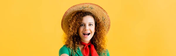 Amazed woman in straw hat isolated on yellow, banner — Stock Photo