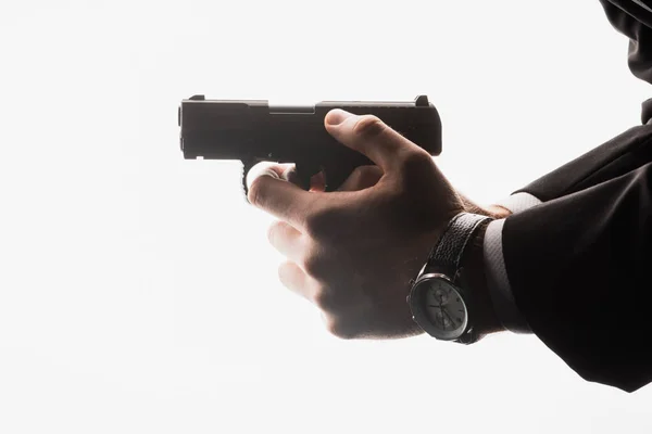 Partial view of dangerous man holding gun isolated on white — Stock Photo