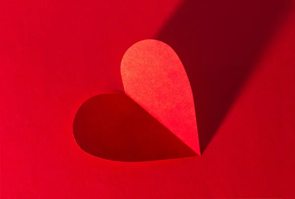 Paper heart on red background — Stock Photo, Image