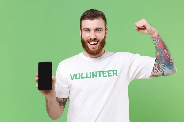 Homem Forte Shirt Voluntária Isolado Fundo Verde Pastel Assistência Voluntária Imagens De Bancos De Imagens Sem Royalties