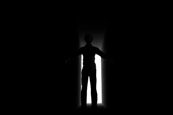 Чоловічий силует, що досліджує світло порталу — стокове фото