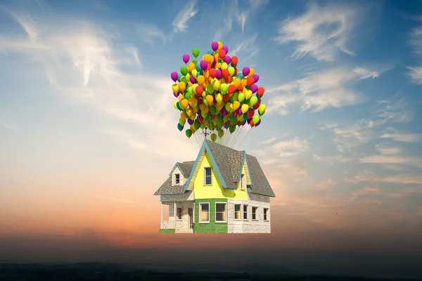 Wooden victorian house flying up — Stock Photo, Image