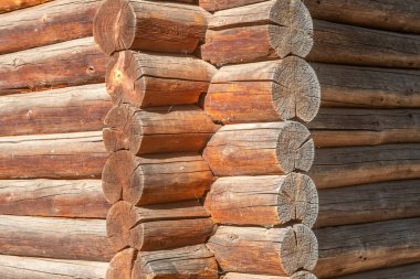 Traditional wooden log corner with visible timber joints.