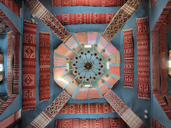 Ceiling of towel museum decorated with traditional Ukrainian embroidered rushnyk textiles and central chandelier. Pereiaslav, Kyiv Oblast, Ukraine, September 27, 2025.