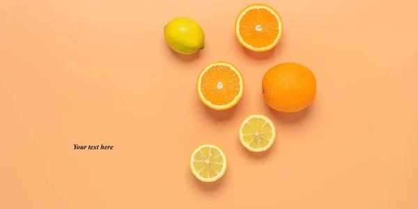 Fresh orange and lemon on a pastel yellow background. Top view, flat lay, banner. Summer tropical background