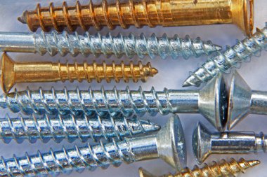 Close up view of newly manufactured screws clipart