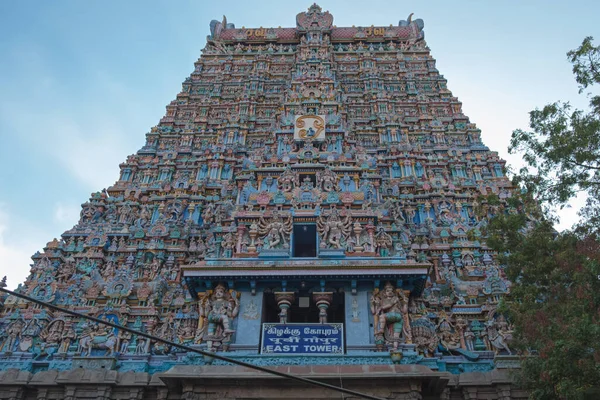 The eastern Gopuram, or gateway tower, of the Meenakshi temple complex covering 45 acres at Madurai in Tamil Nadu state, India. Although hundreds of years old it was only in the last century that temple authorities began to paint the carvings