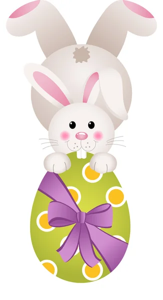 Easter bunny holding a large chocolate egg — Stock Vector