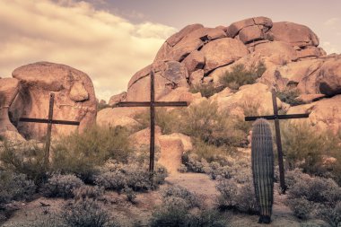 Crosses in desert boulder location - Spiritual religious worship clipart