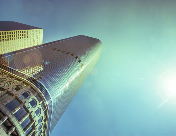 Modern skyscraper with bright blue sky