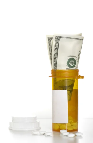 Piller, recept flaska och pengar dollar — Stockfoto