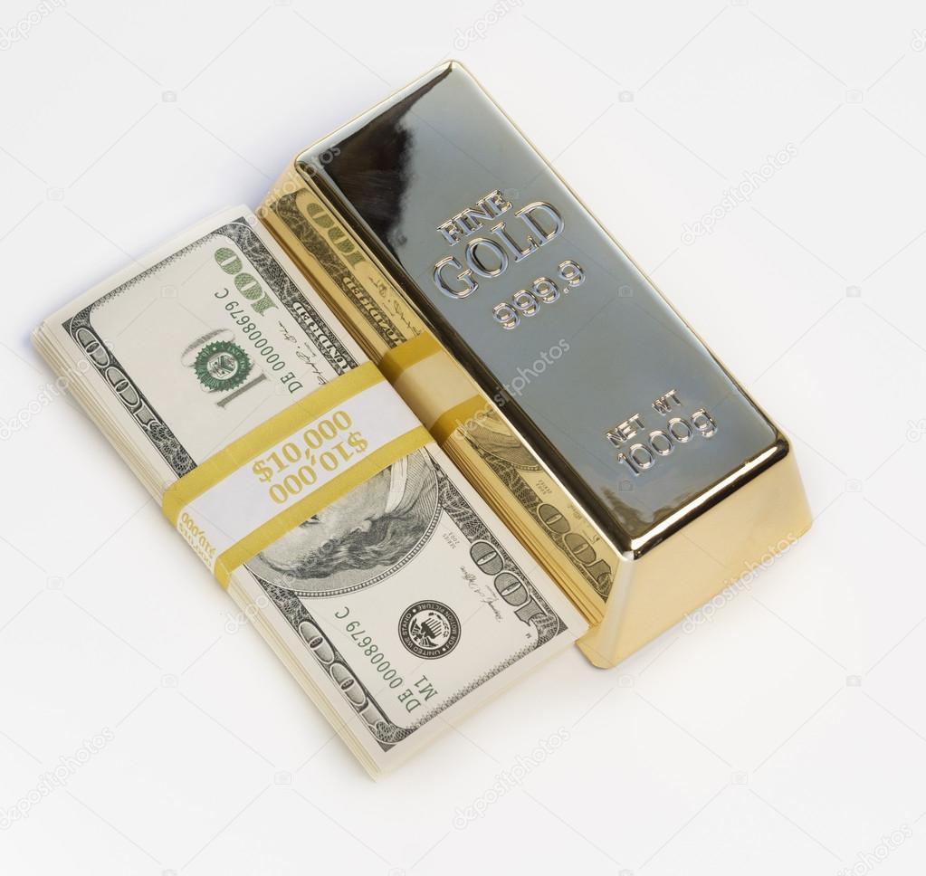 Gold bar and dollars.