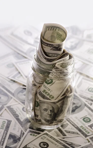 Glass jar with hundred dollar bill — Stock Photo, Image