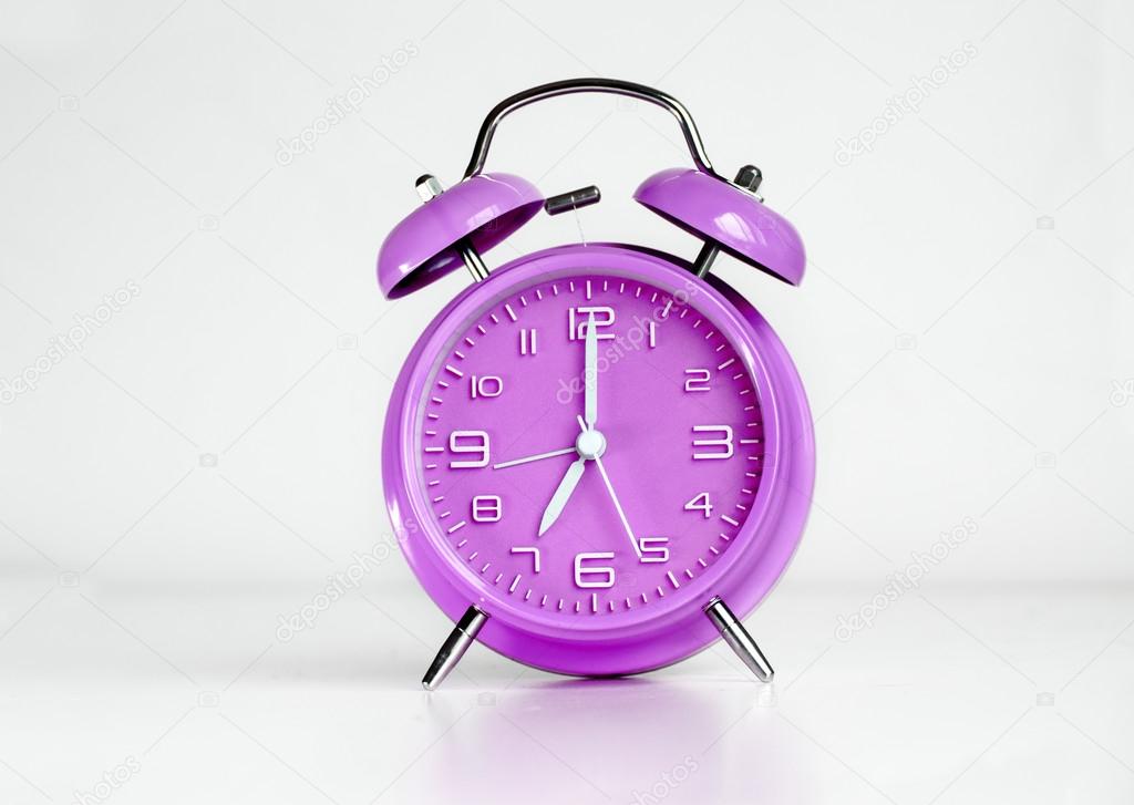 Purple twin bell alarm clock Stock Photo by ©AVFC 82666296