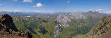 mountain chain over a green valley