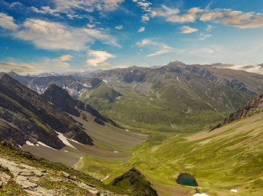 mountain chain over a green valley