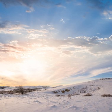 mountain in a snow at the sunset