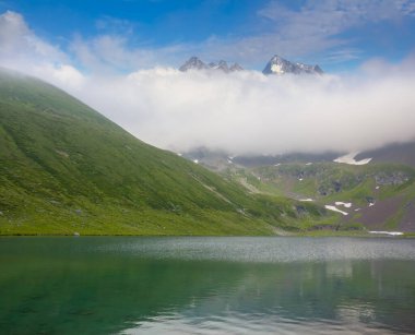 beautiful emerald lake in mountain valley, natural travel background