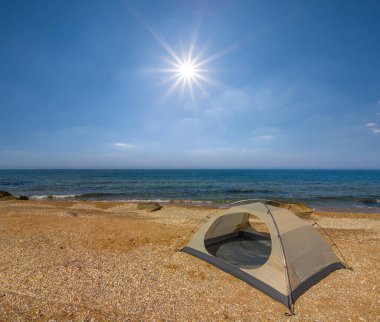 touristic tent stay on sandy sea  beach  at the summer day