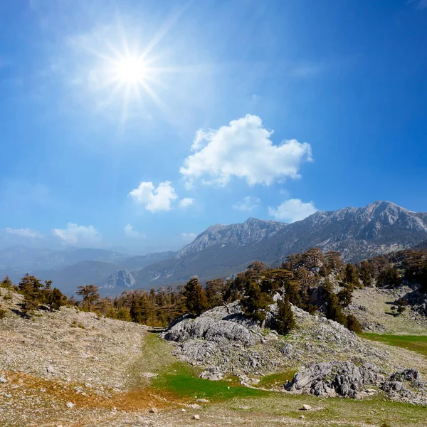 green mountain valley under a sparkle sun, travel mountain background