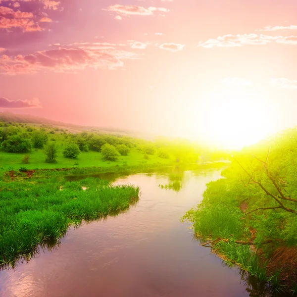 Dramatic sunset over a river — Stock Photo, Image