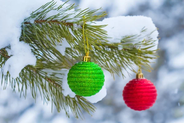 New year toys on a pine branch — Stock Photo, Image