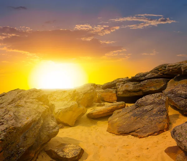 Dramatic sunset over a stony desert — Stock Photo, Image