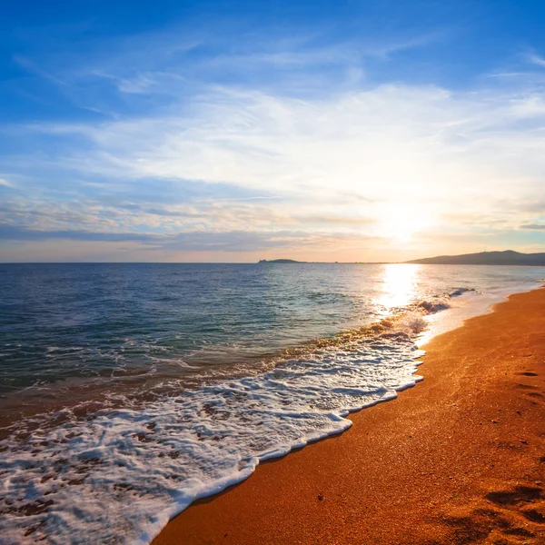 Sunset over a sea coast — Stock Photo, Image