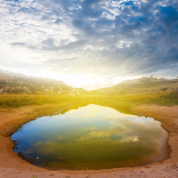 Small desert lake at the sunset — Stock Photo, Image