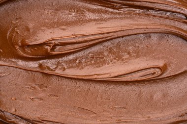 Erimiş çikolata dokusu arka planı. Yakın plan kremalı çikolata..