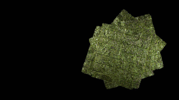 Seaweed. Dry nori leaf isolated on black
