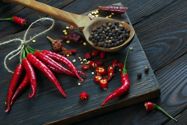 red hot chili peppers on a wooden table. pods of red hot pepper.