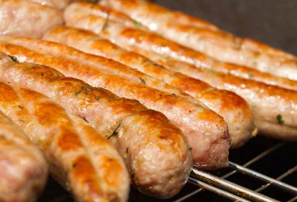 Sausages on a grill — Stock Photo, Image