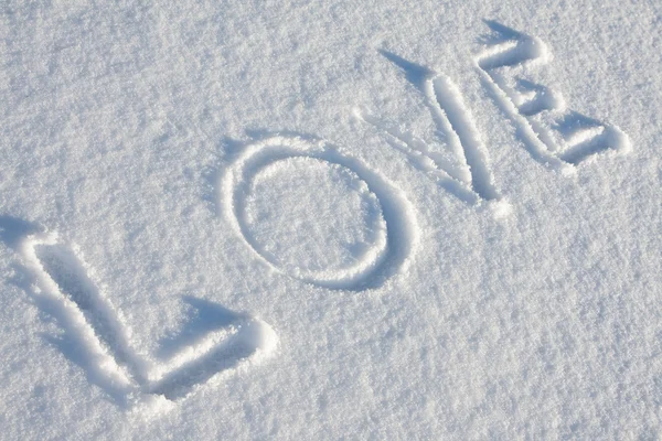 Text love på snön — Stockfoto