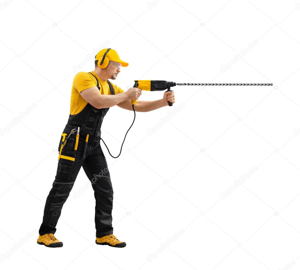 worker handyman repairman or builder worked with construction tool - hammer drill percussion perforator , stand full body in black - yellow uniform on white background, isolated. Repair service and construction concept