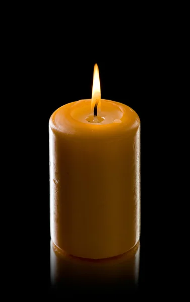 Свеча на черном — стоковое фото