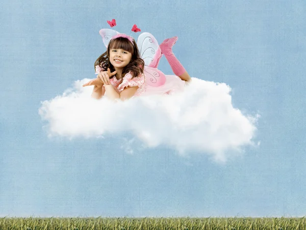 Little girl with wings clouds — Stock Photo, Image