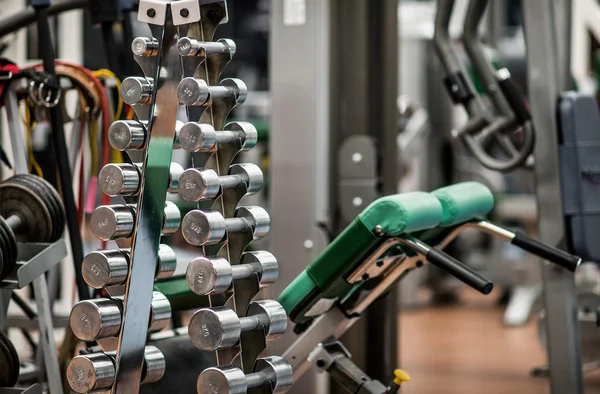 Dumb bells in gym — Stock Photo, Image