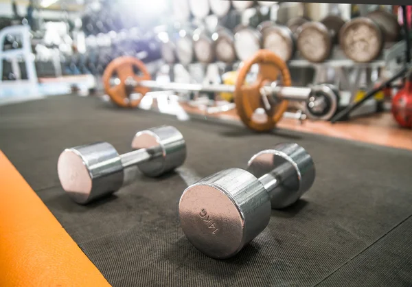 Dumb bells in gym — Stock Photo, Image