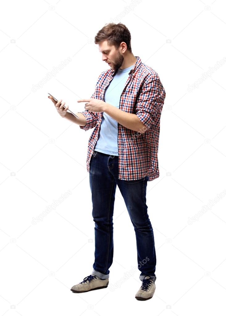 Smiling young man using tablet computer against white background