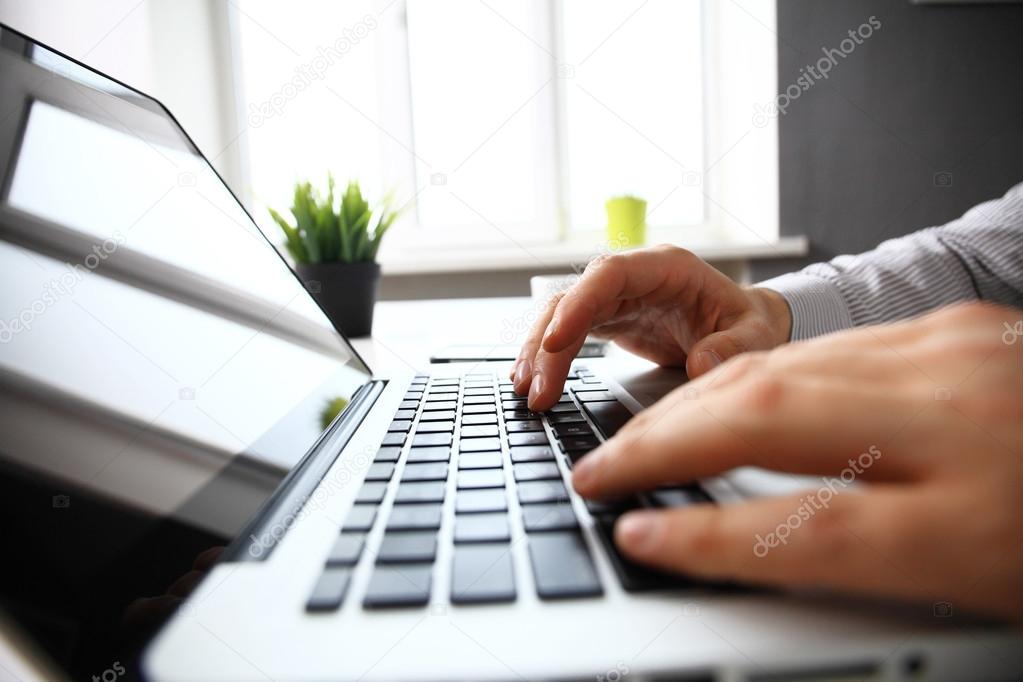 businessman typing on keyboard