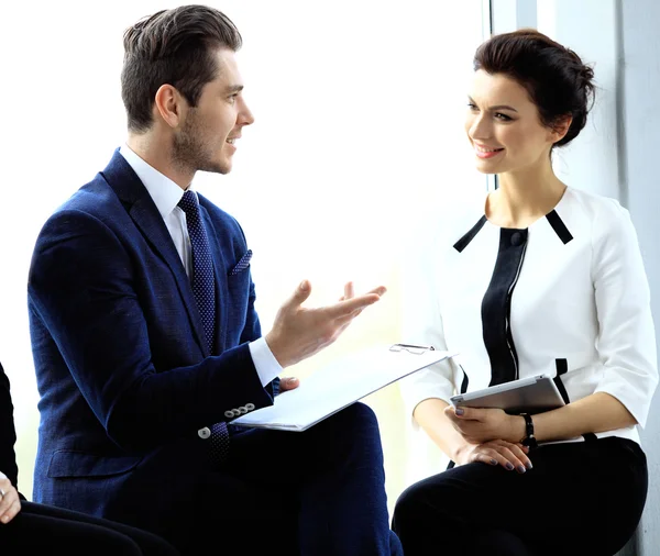 Business partners discussing documents and ideas at meeting — Stock Photo, Image