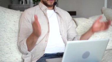 Young salesman holding online video call with client, talking about service or helping solve problems remotely
