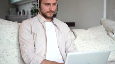 Young salesman holding online video call with client, talking about service or helping solve problems remotely