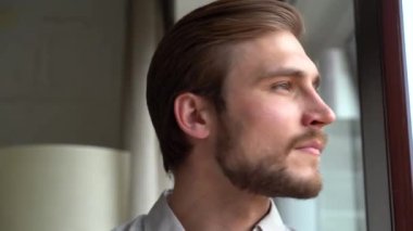 Smiling millennial professional businessman looking at camera. Close up face view business portrait