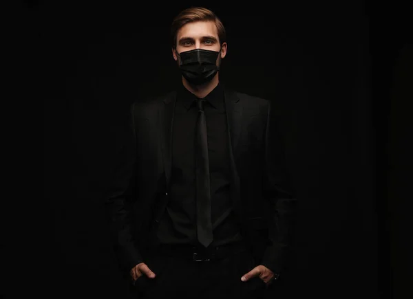 Business Concept - Portrait Handsome Businessman in protective face mask on black background — Stock Photo, Image