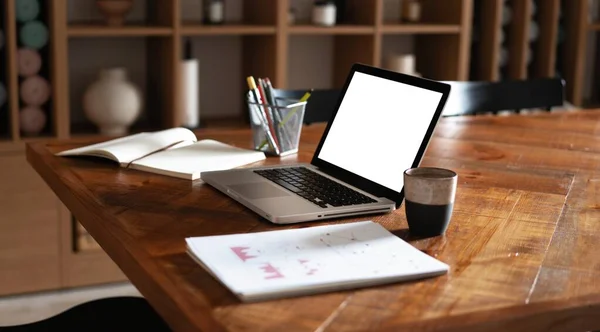 Modern creative workplace with laptop notebook mock up white empty screen on desk at work space office room interior — Stock Photo, Image