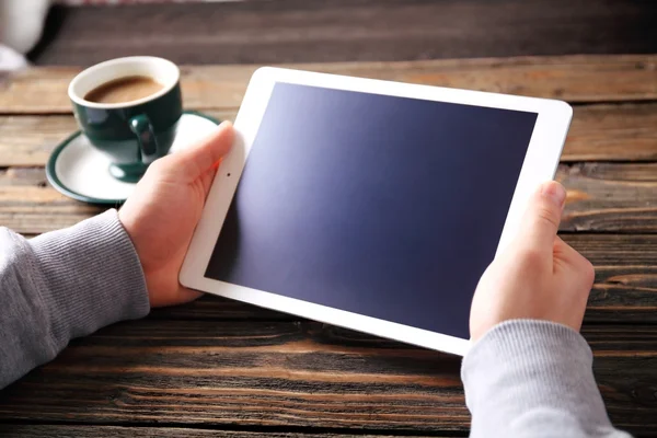 Hands of a man holding blank tablet device — Stock Photo, Image