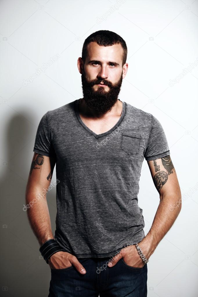 Bearded man wearing gray t-shirt